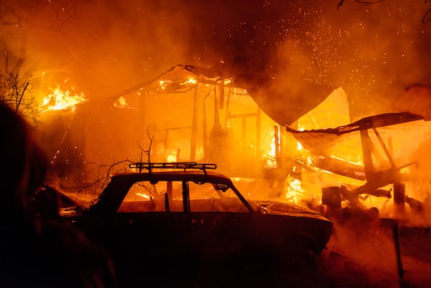 house-fire-at-night-with-burnt-car-in-smoke-2021-09-24-04-28-45-utc-2